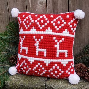 Red and white crochet reindeer pillow