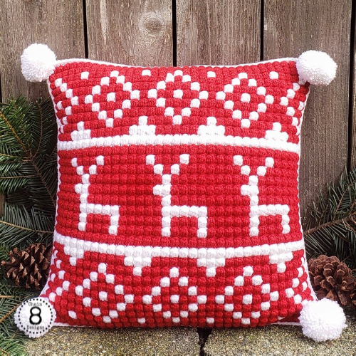 Red and white crochet reindeer pillow