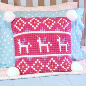 Picture of pink crocheted unicorn pillow.