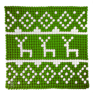 Green and white crochet reindeer pillow front