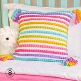 Rainbow striped crochet pillow made using the Bobble Stitch Striped Pillow pattern